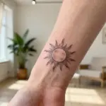 14 Sun Wrist Tattoo Ideas With Minimal Glow